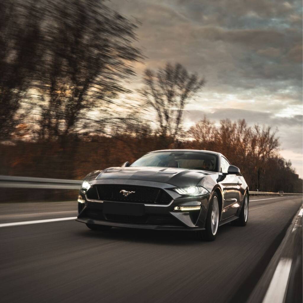 luxury car driving on road