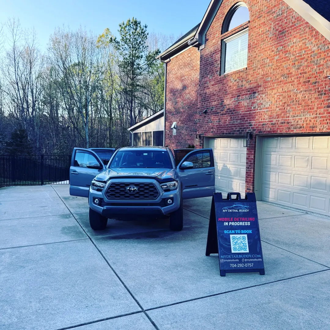 Toyota truck being detailed in a Waxhaw driveway with the My Detail Buddy sign