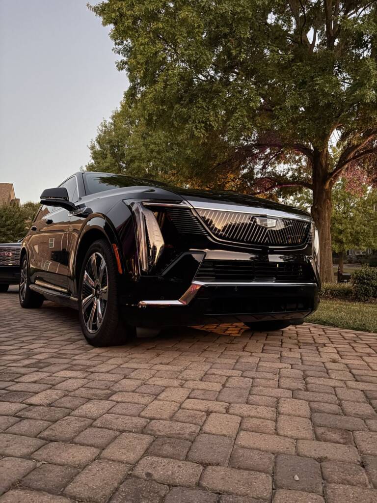 Black Cadillac paint at dusk after detailing