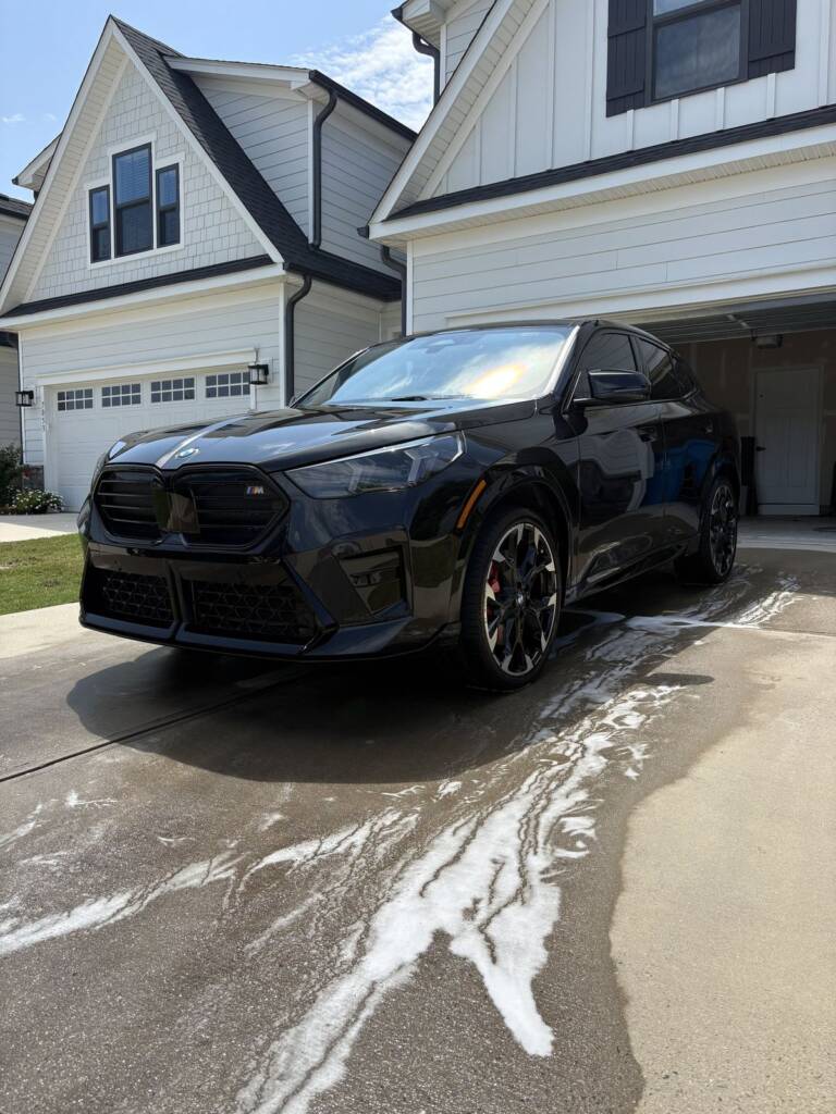 Black SUV during a hand wash at the customer's home