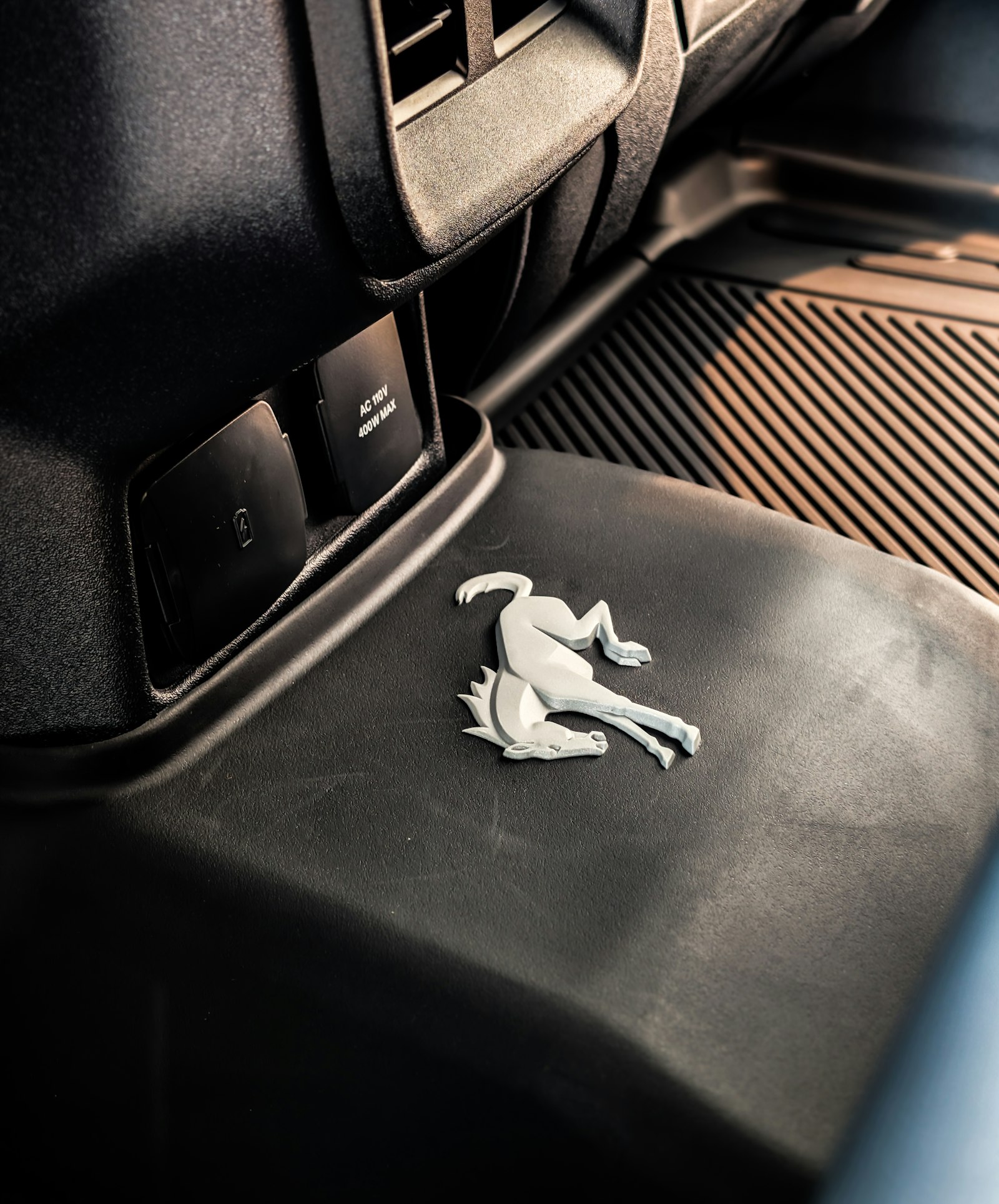 Rubber all-weather floor mat in a car footwell